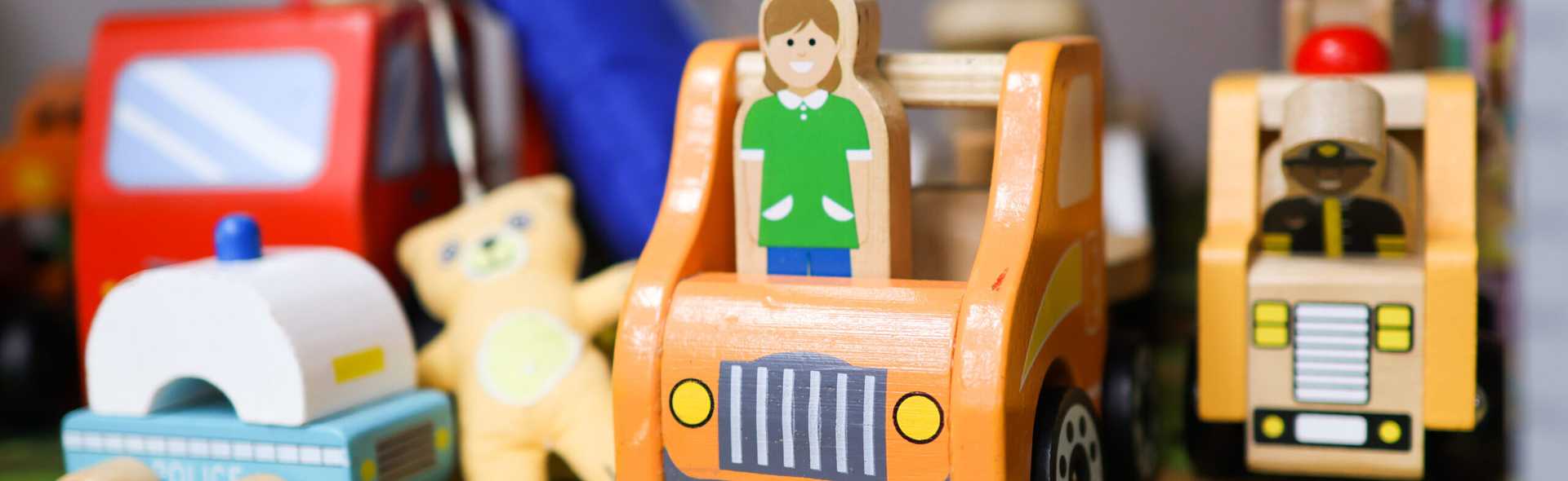Close up of wooden vehicles on a shelf